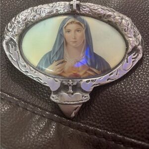 Vintage silver toned Tattooed Kingpin western heart of Mary belt buckle.